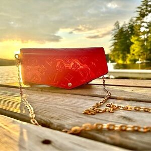 Red leather, Louis Vuitton over the shoulder bag.